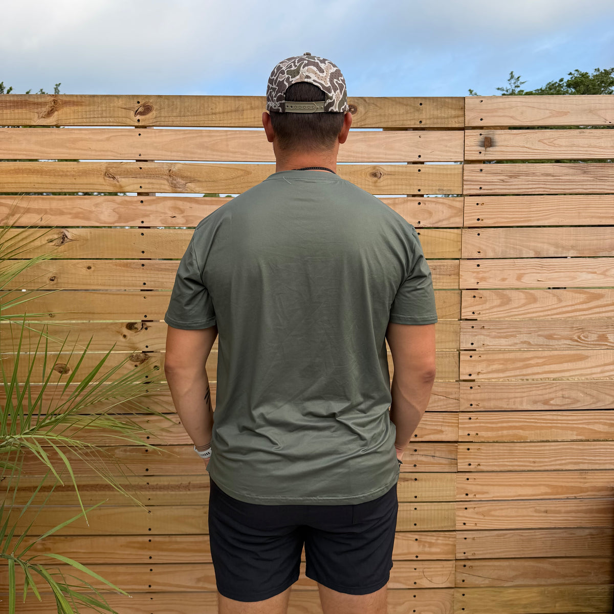 SqdDrift tee by Salt SQD in Marsh Green, shown from the back with four-way stretch fabric for easy movement.