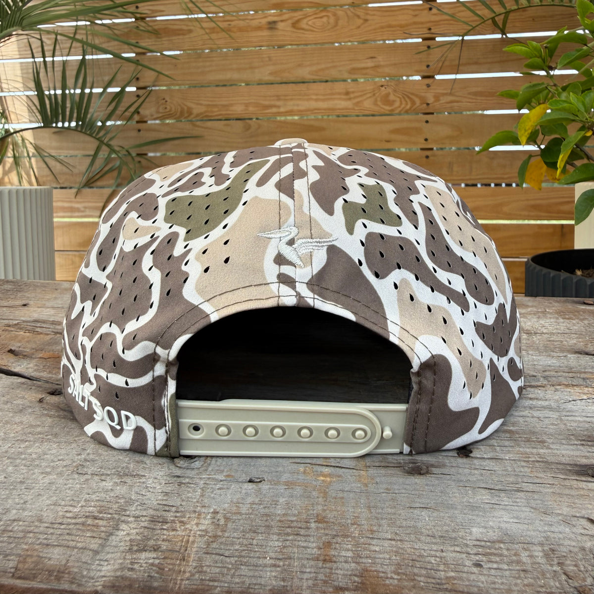 Salt SQD Coastal Reserve Cap in Marsh Camo, rear view showing perforated panels, snapback closure, and Salt SQD branding