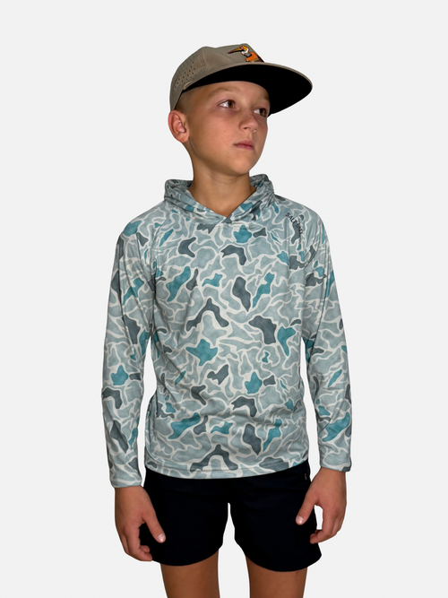 Youth Salt SQD SqdDrift fishing hoodie in Bonefish Camo with UPF 35 sun protection for beach activity wear.