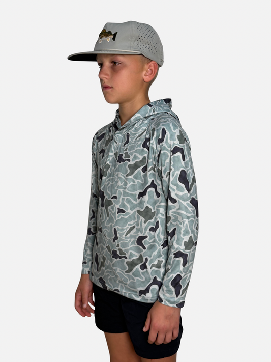 Youth Salt SQD SqdDrift fishing hoodie in Speckled Trout Camo with four-way stretch fabric for beach activities.