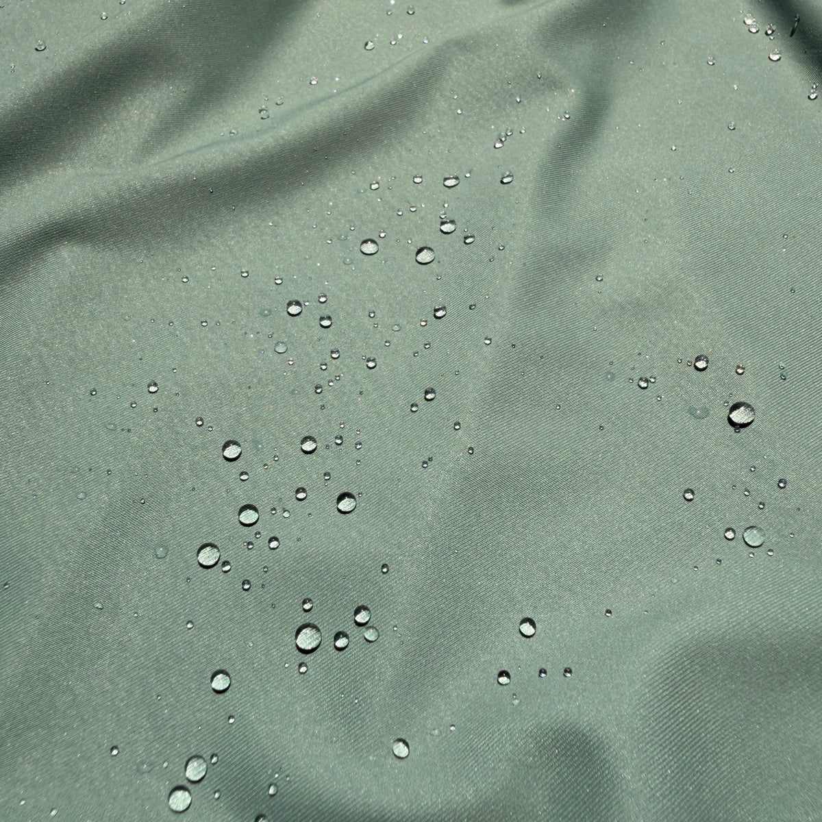 Salt SQD Coastal Core bundle in Salt Sage with durable water-repellent cap fabric and visible water droplets.