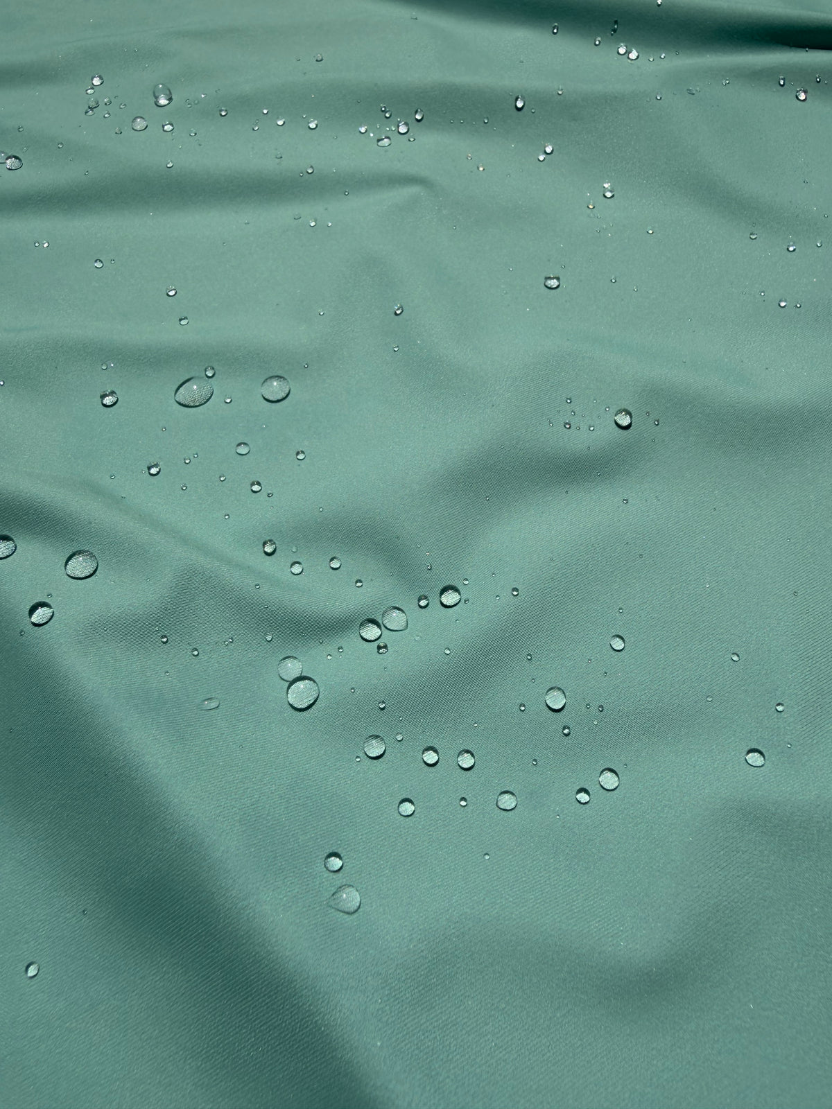 Performance fabric with durable water repellent treatment