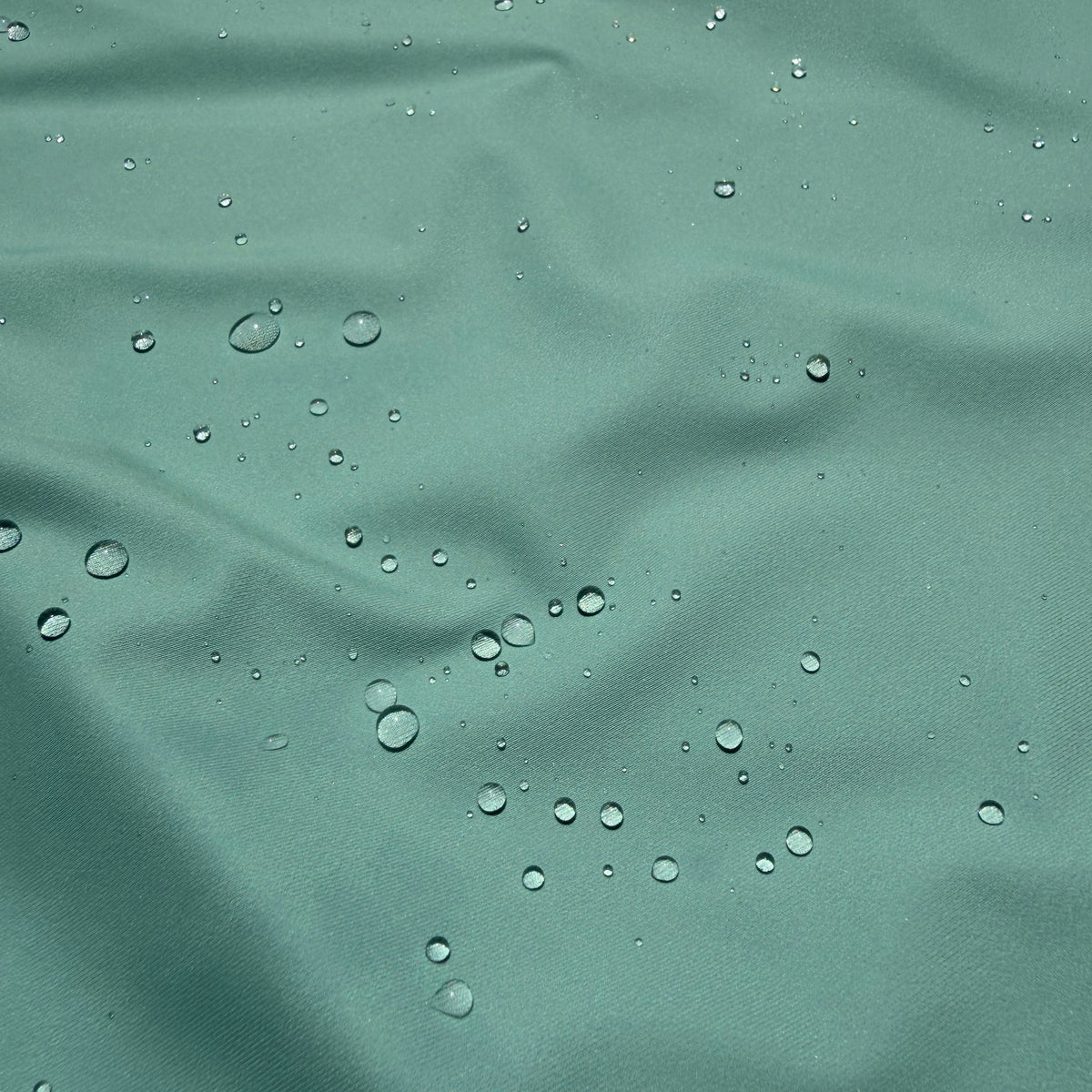 Coastal Core bundle by Salt SQD in Salt Sage with durable water repellent cap fabric beading visible droplets.